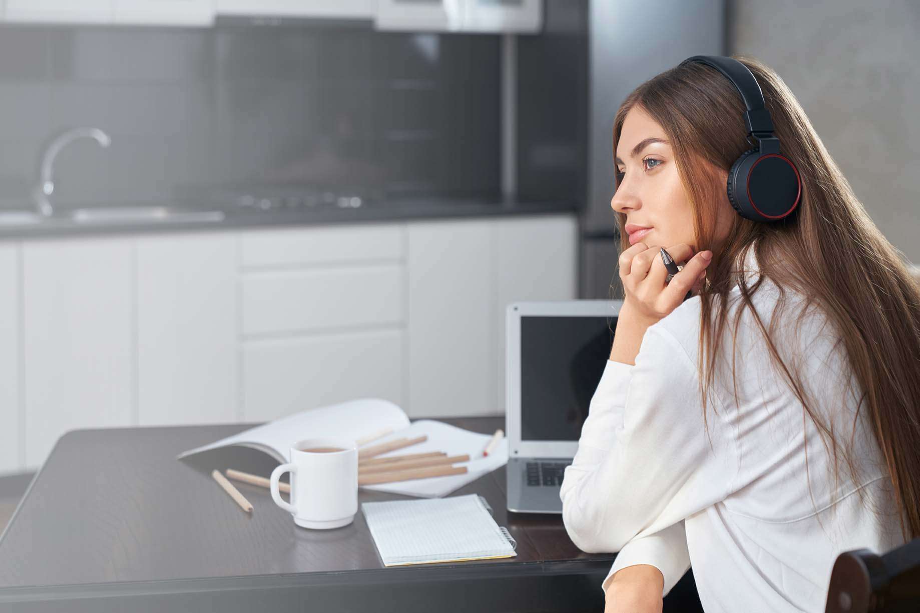 thoughtful-student-using-laptop-and-headphones-for-2021-05-07-23-15-28-utc.jpg Young african male student freelancer businessman talking on video call conversation online